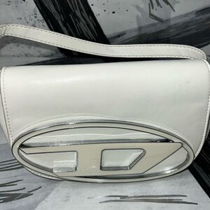 White Diesel bag barley worn, In PERFECT condition. It goes with everything!